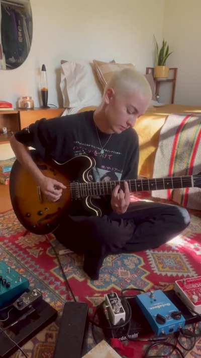 Playing along to La Perla on guitar!