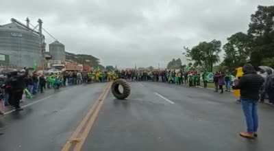 Here in Brazil, our imported QAnon refuses to aknowledge Bolsonaro's defear and is currently blocking streets nationwide. Here you can see them singing the national anthem to a tire