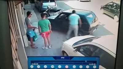 Guy lifts a car with his hands