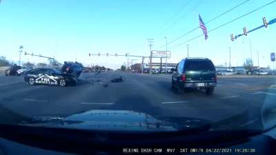 Idiot blows through red light and hits & flips an SUV carrying an entire family right in front of me.