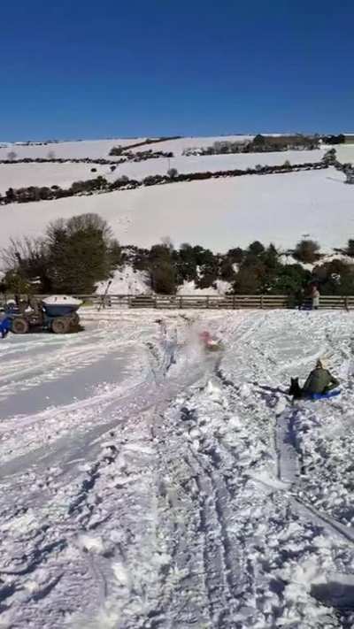 To ride a kayak down a snowy hill