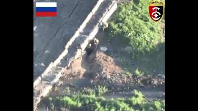 Ukrainian fighter shoot visible enemy at close range with small arms fire during assault on Russian-held bridge near Bakhmut. May 2023
