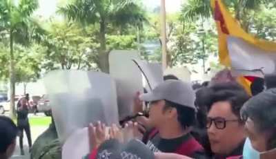 Protesters gather outside the Israel Embassy in BGC, passionately demanding 'Free Palestine' and condemning Israel's actions in Gaza. Tensions rise as Philippine police and military respond.