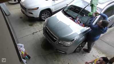 WCGW hanging the piñata over the wipers and then turning the car on