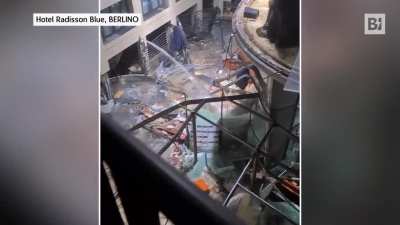 Largest free standing cylindrical aquarium in the world containing 1,500 fish bursts open in Berlin.