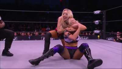 The Bunny applies a cobra clutch on Anna Jay