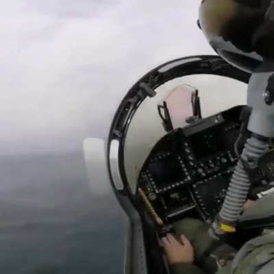 Cockpit view of a fighter jet taking off.