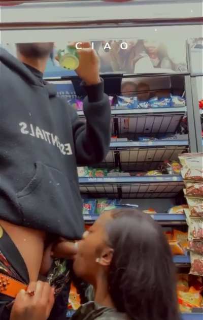 Ebony blowing her boyfriend in the deli