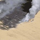 farmer with pressence of mind cutting off crop fire