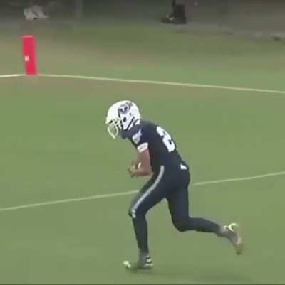 This kid makes a seemingly impossible catch during a football game