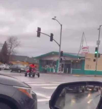 ATV rider shuts down an intersection in Oakland California