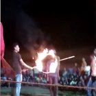 Man dives through a flaming hoop