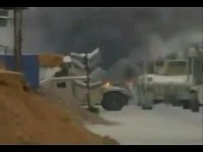 US Army M1A1 Abrams being pelted by Molotovs after being disabled by an IED (August 16, 2004).