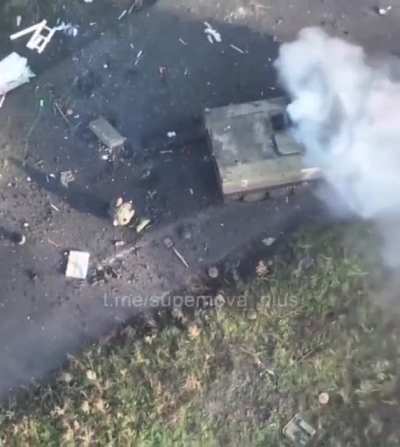 Russian tank running over anti-tank mines on a road. Even I can tell that there's something in the road that's probably a mine.