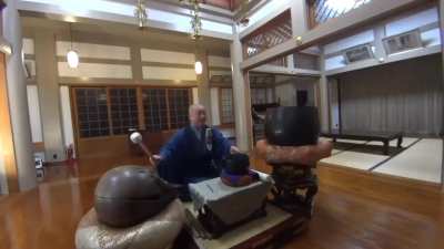 Japanese Monk Playing Cultural Music With Traditional Instruments