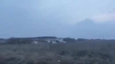 Ukrainian soldier firing FGM-148 Javelin at an abandoned Russian vehicle