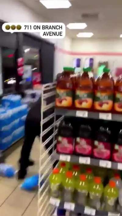 7/11 workers tag team a bum in a brawl