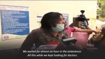 Grieving woman screams at reporters after her father died on a stretcher outside the hospital. No doctors came to see him. No medical assistance was given. Situation in India is just getting worse and worse.