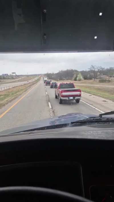 Truck driver blocking lane before it ends