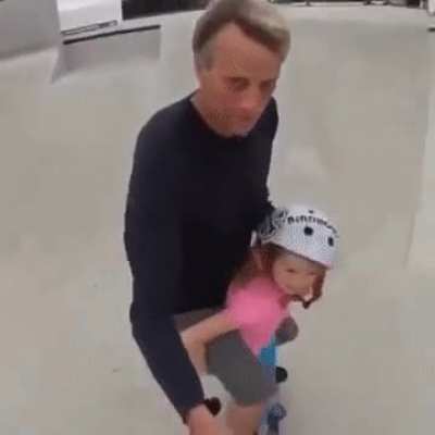 Tony Hawk riding with his daughter when she was four