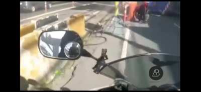 Collapsed crane on a busy road