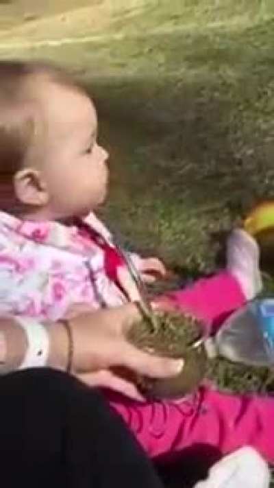 Baby tries herbal tea for the first time