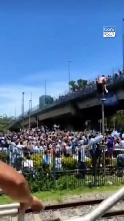 Argentinian fan attempts to get on the team bus by jumping off a bridge