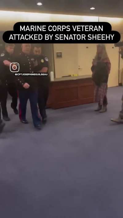 Former Marine Brian McGuinness stood up to a senator during a hearing about the war on Iran to say what millions of Americans are saying. For doing so, his hand was broken by police.