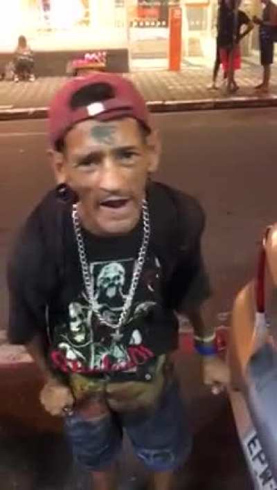 [NSFW] Man showcasing hits nuts in a public street