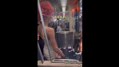 Dude Sparta kicks a woman in the chest after she tried holding up the train in Philly