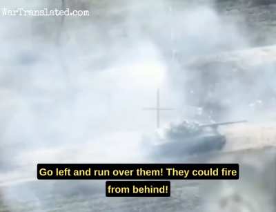 A dramatic video shows two Ukrainian warriors attacked by a tank: the tank misses them and Ukrainians fire an RPG at it. ( Now with English subtitle from the Russian drone)