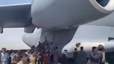 Escape from Kabul. Afghans fleeing Taliban militants hoping to leave the country - tied themselves with ropes to the plane.