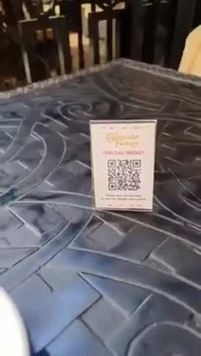 Man switched QR Codes of restaurant menus.