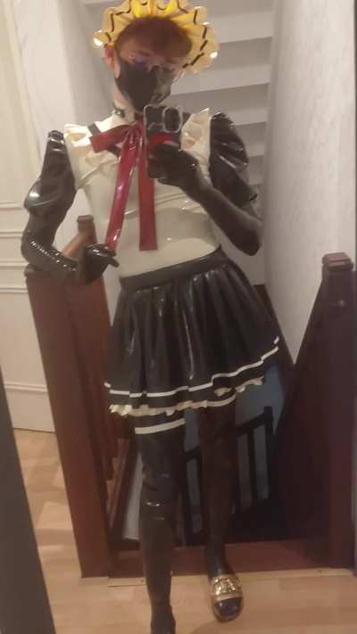 Latex Maid enjoying her latex outfit
