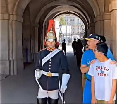 Dad making sure his kid keeps a safe distance from the guard