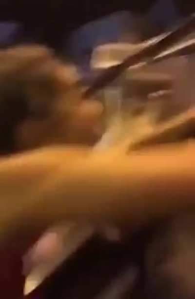 Trying to bodysurf an escalator's handrail