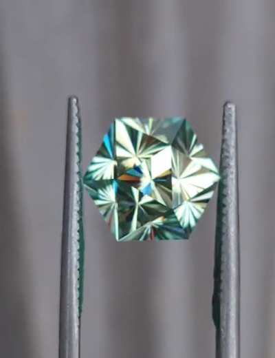 Sorry if not allowed, I thought this might be appreciated here. I cut a gem by request to look like a D20, but also be practical to set in a ring.