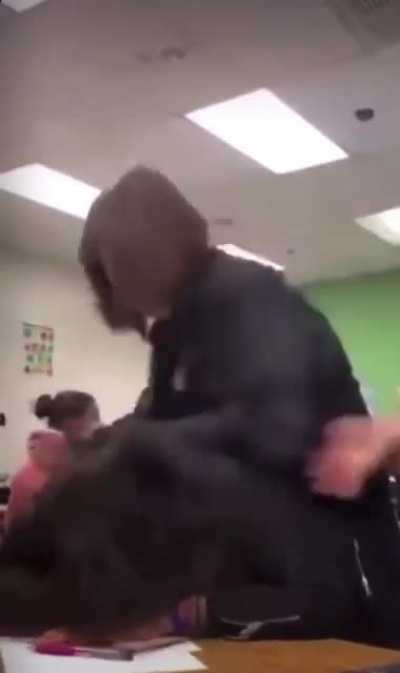The girl beats her classmate