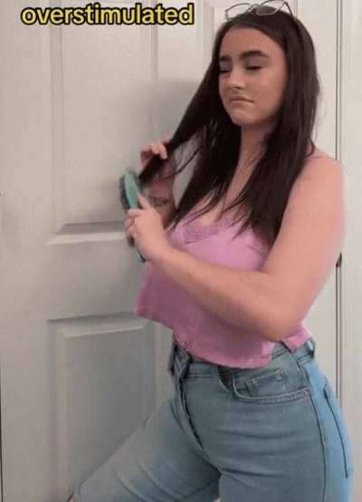 Brushing her hair