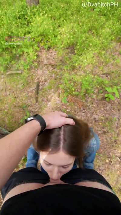 In the woods pushing my head deeper till I gag on his cock