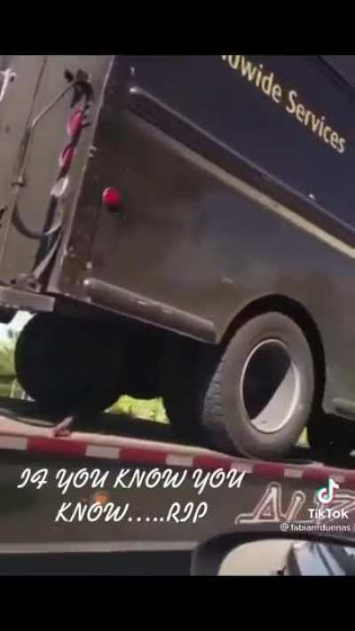 The UPS van driven by the man who lost his life in a police shootout gets towed to the crusher