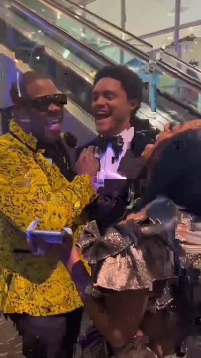 Trevor Noah fanboying with Busta Rhymes (also named Trevor). Fun vibe!
