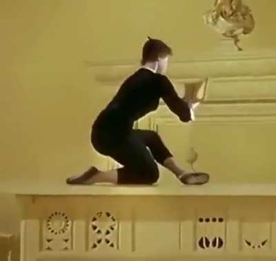 Leslie Caron reading a book in the movie, 