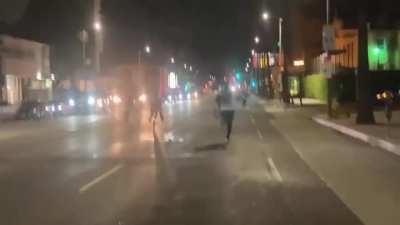 BLM protesters surround a truck, hitting it and trying to open its doors before it drives away