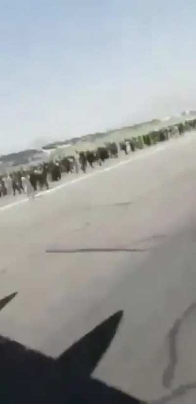 Selfie Angle — The last moments of men clinging to some parts of the C-17 yesterday