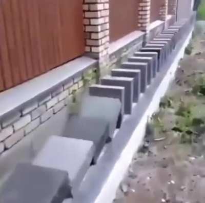 Some guys building a wall