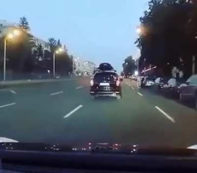 Lucky guy just missed getting hit by the car.