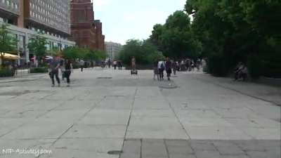 Two Girls Walk Naked Down The Street Riding A Skateboard