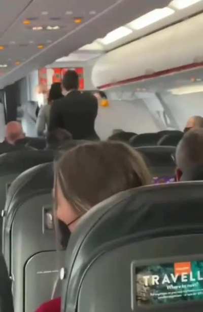 Anti-masker Karen being forced off a plane coughing and yelling 