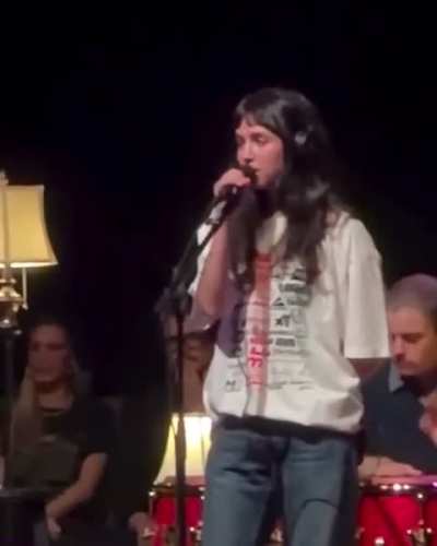 Clairo performing Juna last night at the Artists for Palestine and Sudan benefit at the Shrine Auditorium in Los Angeles